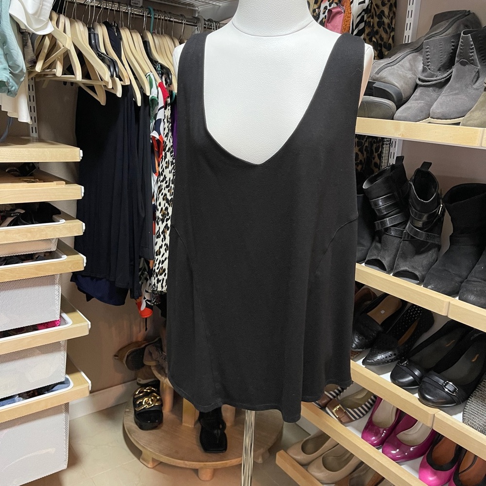 Black tank top with fringe backing.
